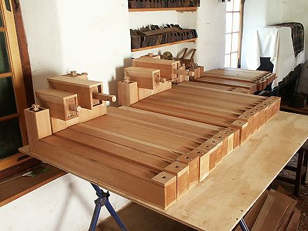 A line of finished mitred pipes